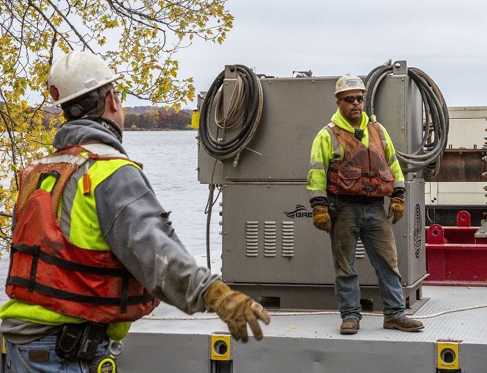 Cletus Bowe and Jason Steiber pre-planning a dredge launch
