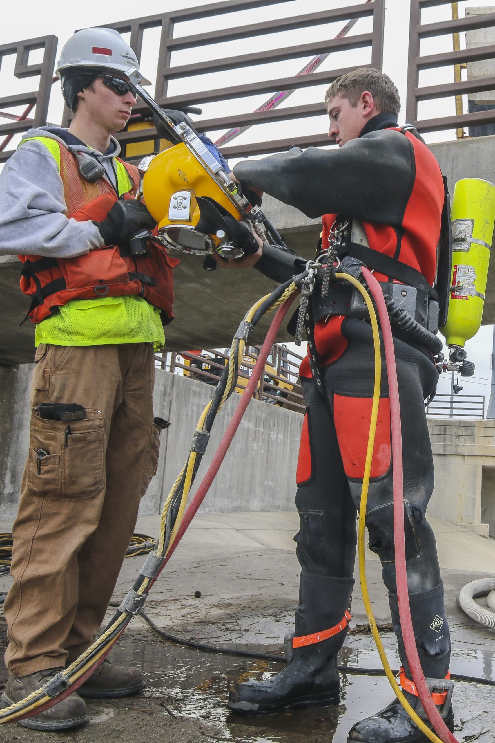 Brennan diver being helped into his dive suit